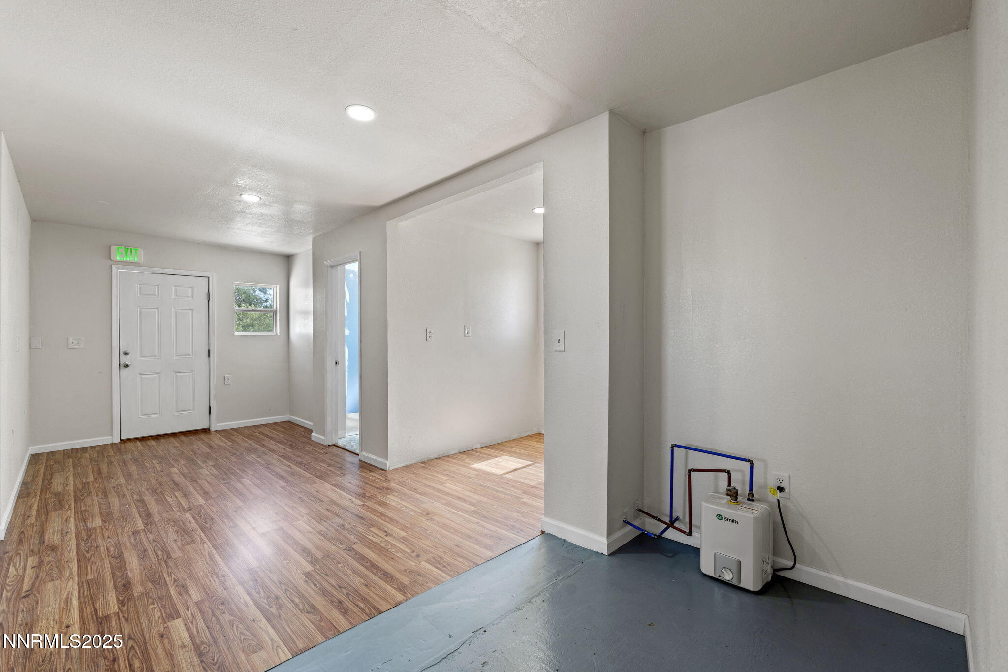 2725 East Fir Street Silver Springs, NV 89429 - Photo 28 of 56 a view of empty room with wooden floor