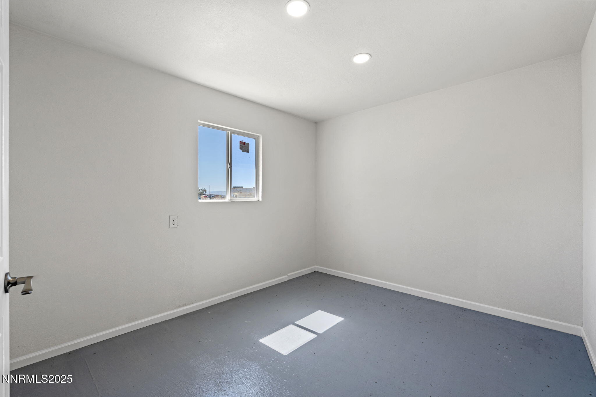 2725 East Fir Street Silver Springs, NV 89429 - Photo 29 of 56 an empty room with a window