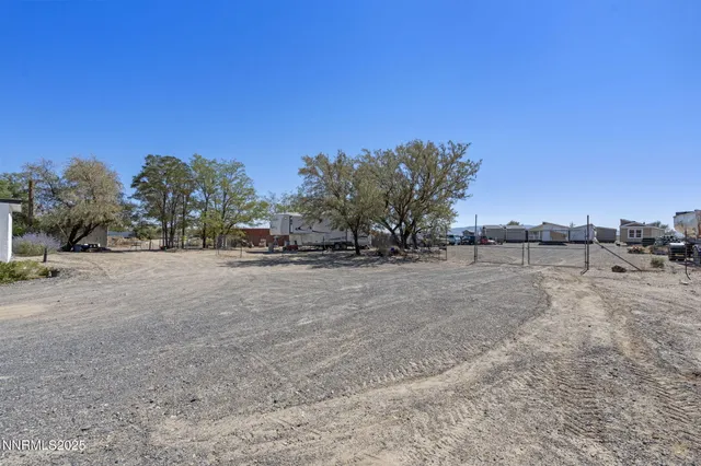 a view of garage yard and tree