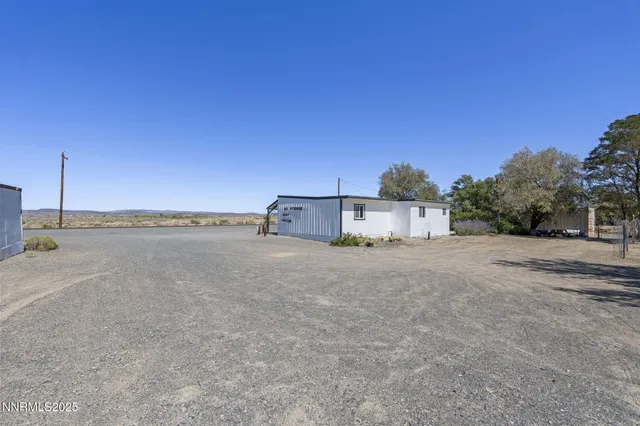 a house with trees in the background