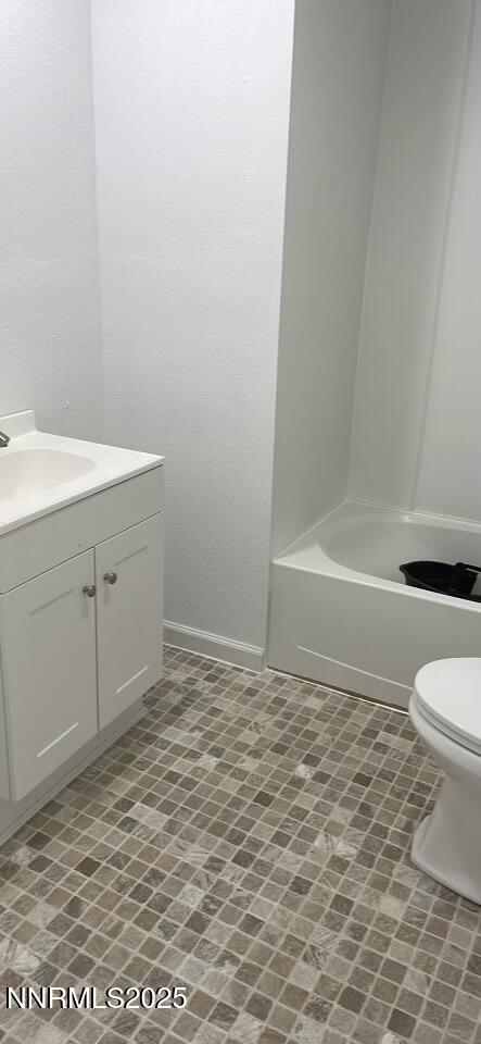 2725 East Fir Street Silver Springs, NV 89429 - Photo 47 of 56 a bathroom with a sink a toilet and a bathtub