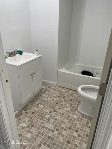 a view of kitchen and empty room