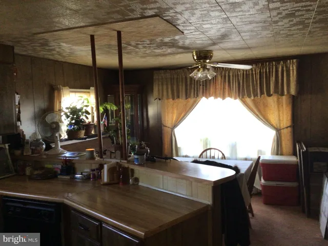 a kitchen with a sink cabinets and outdoor space