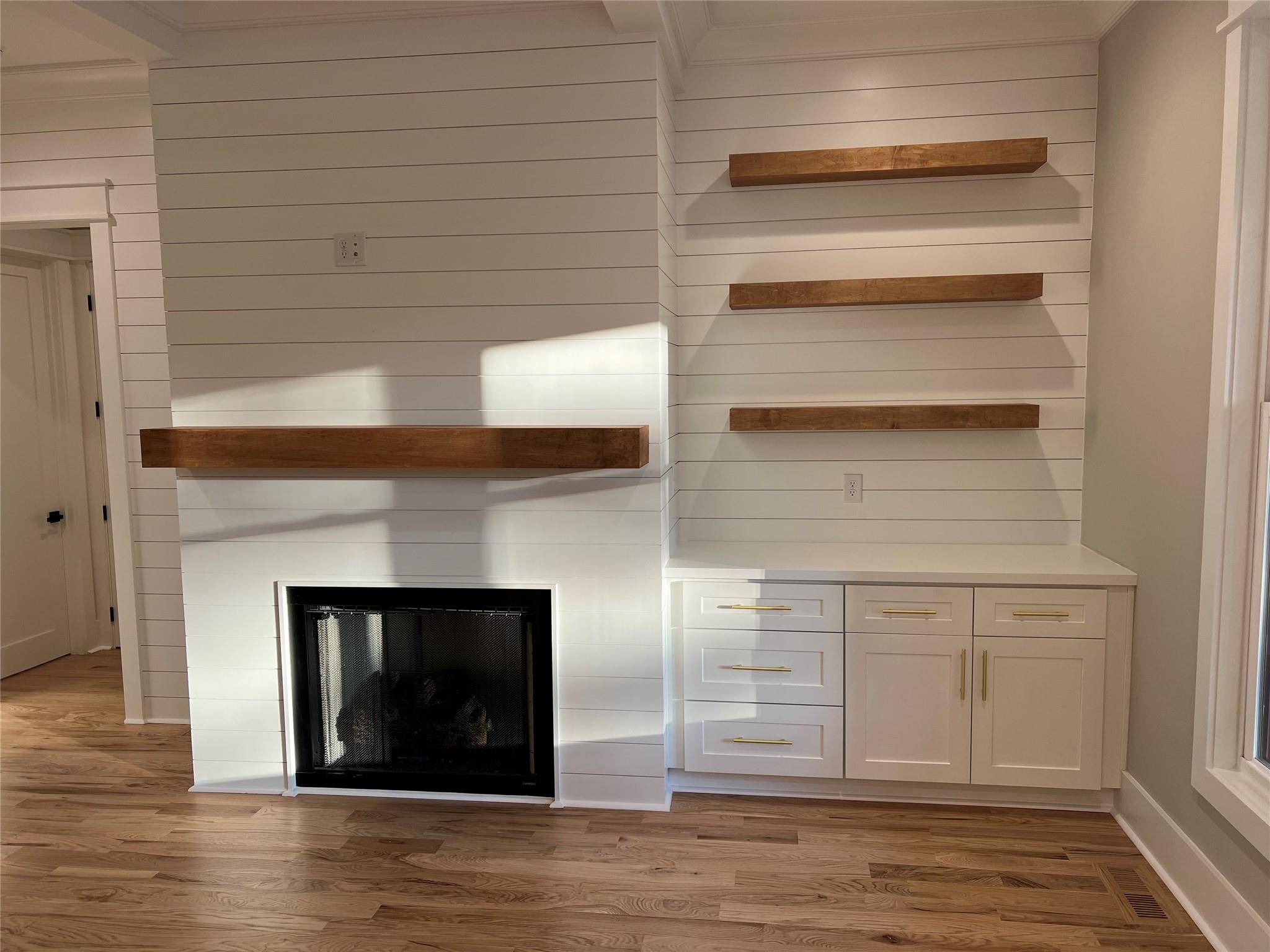 1022 Piney Drive Monroe, NC 28110 - Photo 19 of 48 a view of an empty room with wooden floor and a fireplace