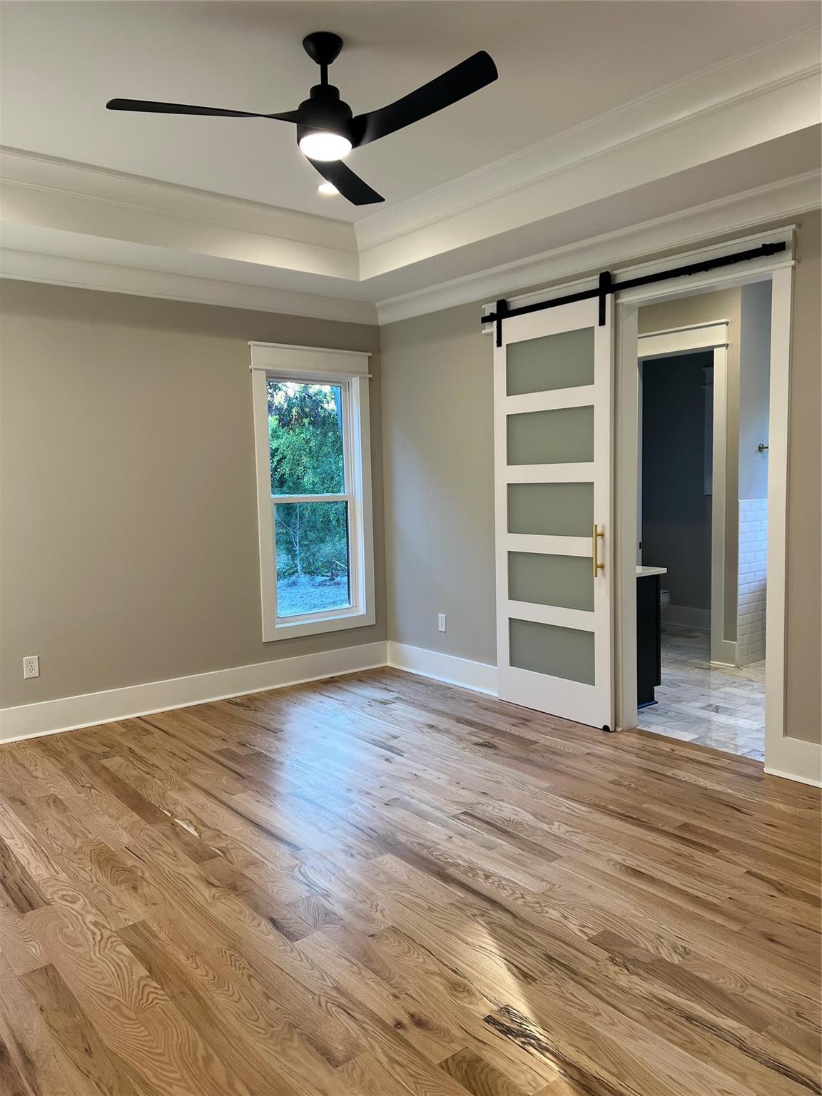1022 Piney Drive Monroe, NC 28110 - Photo 20 of 48 a view of an empty room with a window and wooden floor