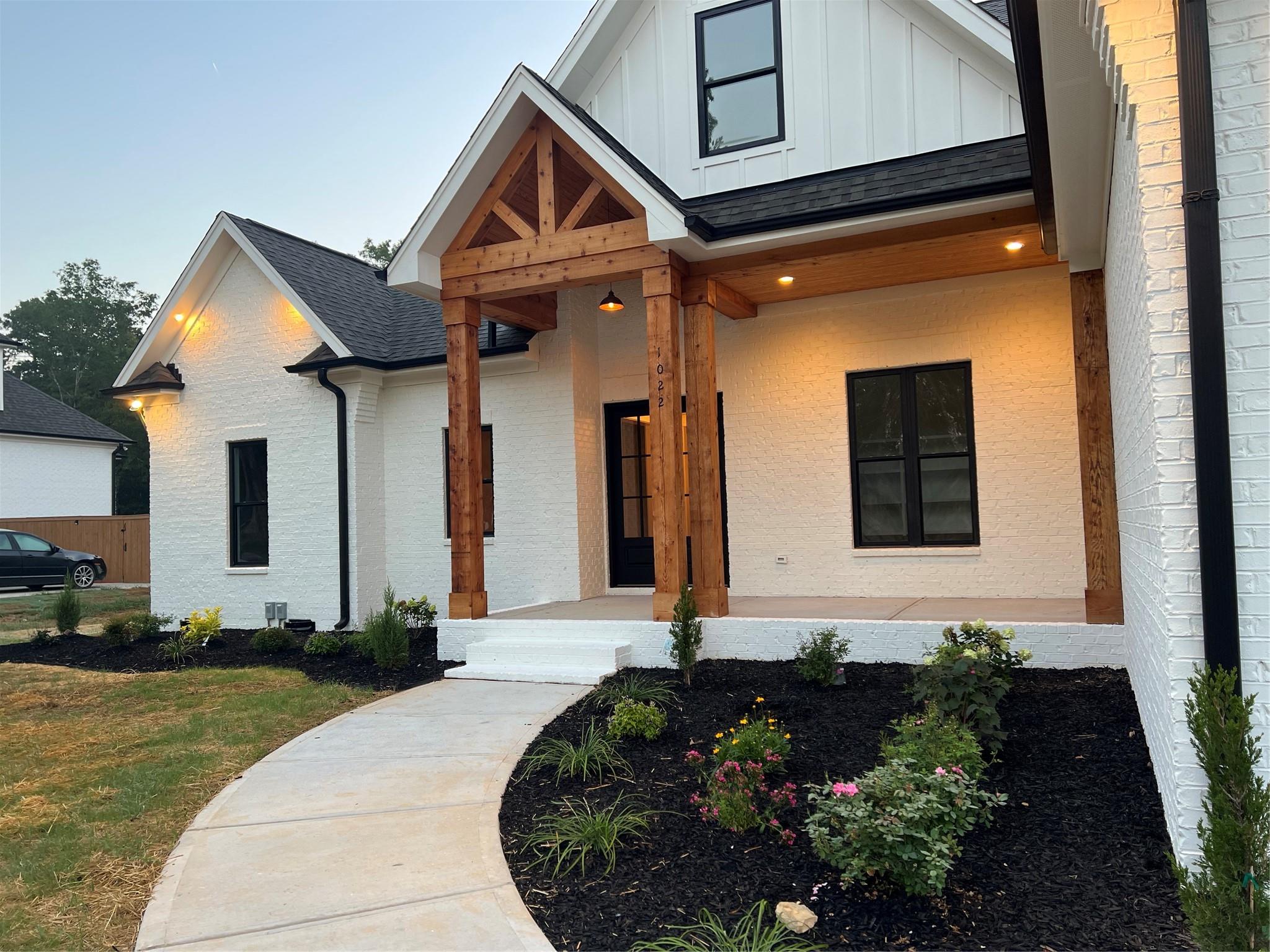 1022 Piney Drive Monroe, NC 28110 - Photo 2 of 48 a front view of a house with a yard