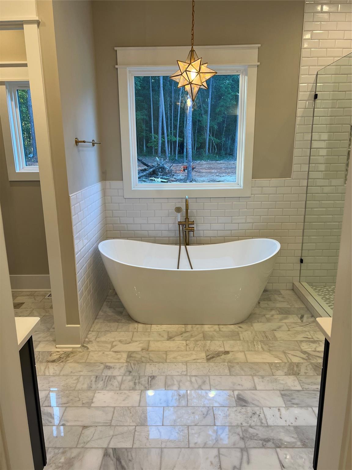 1022 Piney Drive Monroe, NC 28110 - Photo 22 of 48 a view of a bathtub in a bathroom