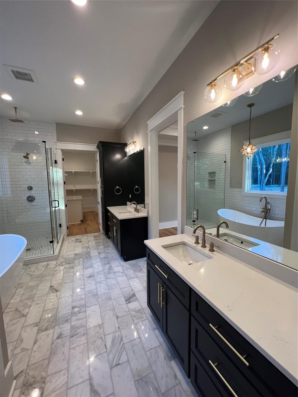 1022 Piney Drive Monroe, NC 28110 - Photo 24 of 48 a large bathroom with a sink a large mirror and a shower