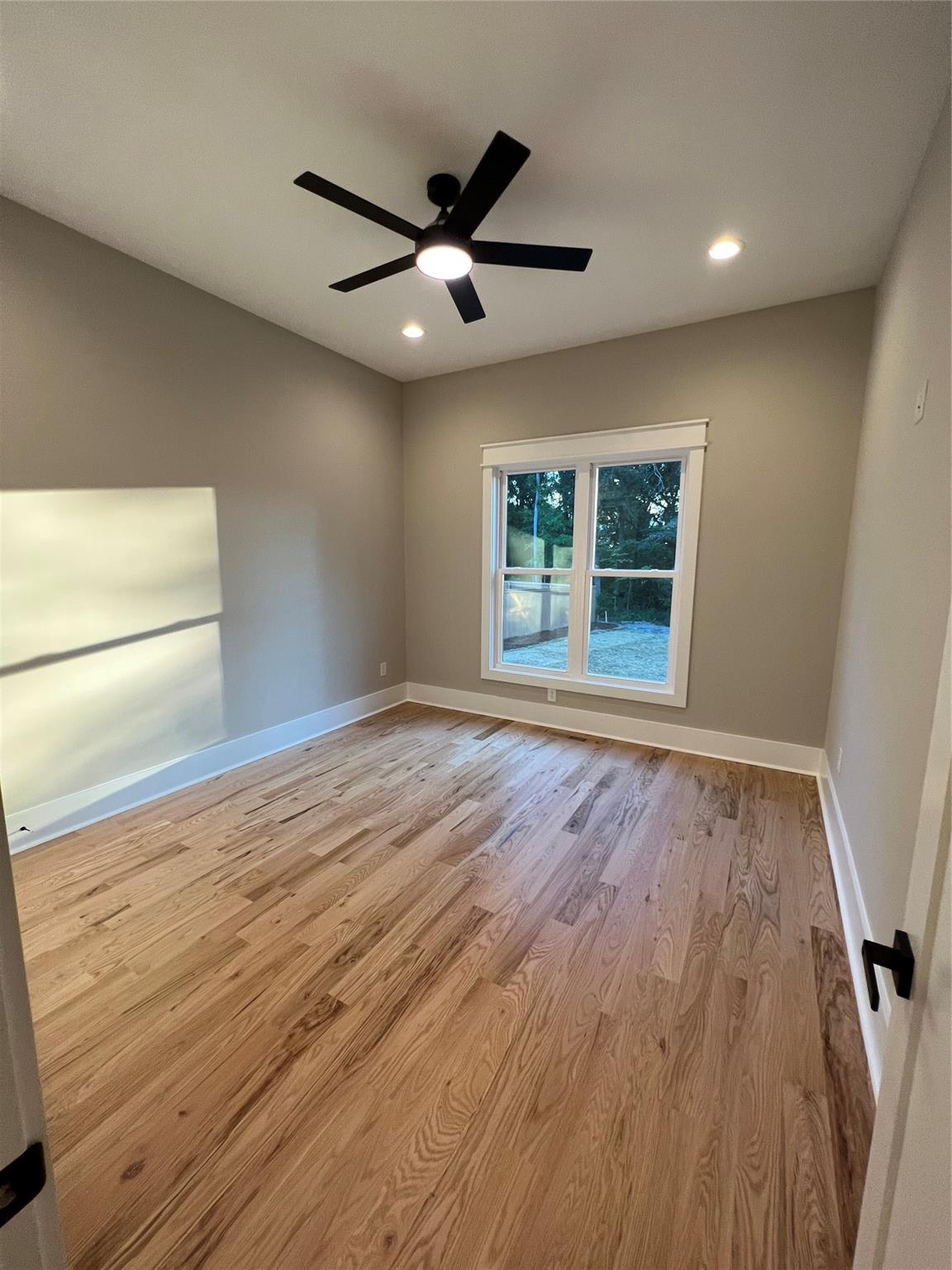 1022 Piney Drive Monroe, NC 28110 - Photo 39 of 48 a view of an empty room with wooden floor and a window