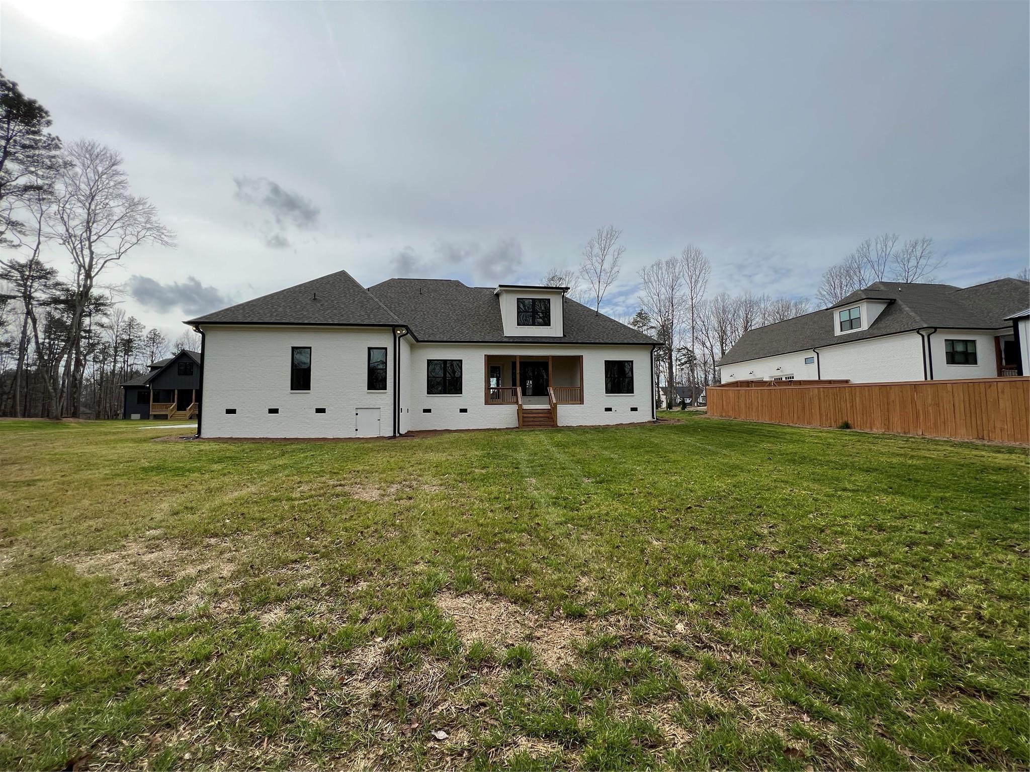 1022 Piney Drive Monroe, NC 28110 - Photo 4 of 48 a front view of a house with a garden and yard