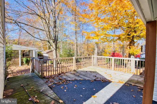 a view of backyard with swimming pool and outdoor seating