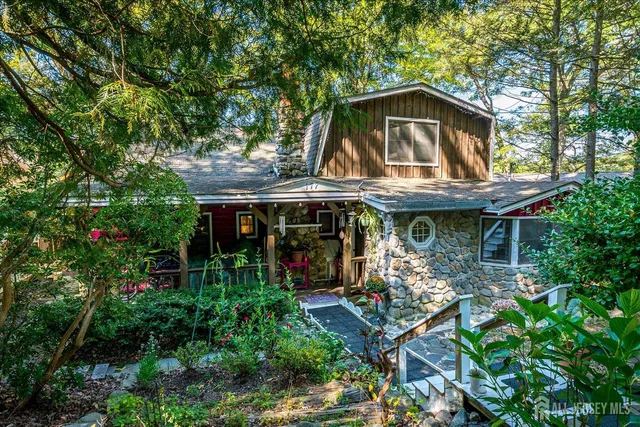 a backyard of a house with lots of green space and fountain