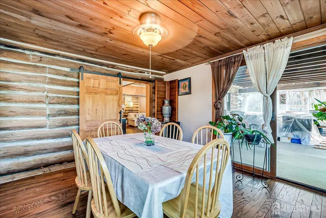 a bed room with furniture and a window