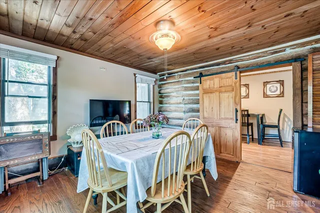 a view of a patio with a table chairs and a backyard