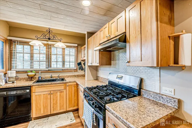 a view of a house with a yard and sitting area