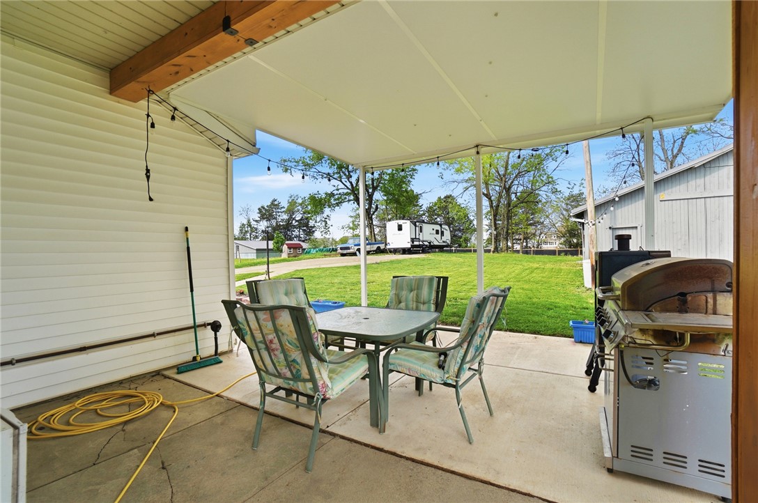 6155 North Union Road Clayton, OH 45315 - Photo 49 of 59 Enjoy outdoor gatherings on this spacious covered patio, perfect for relaxation and entertainment.