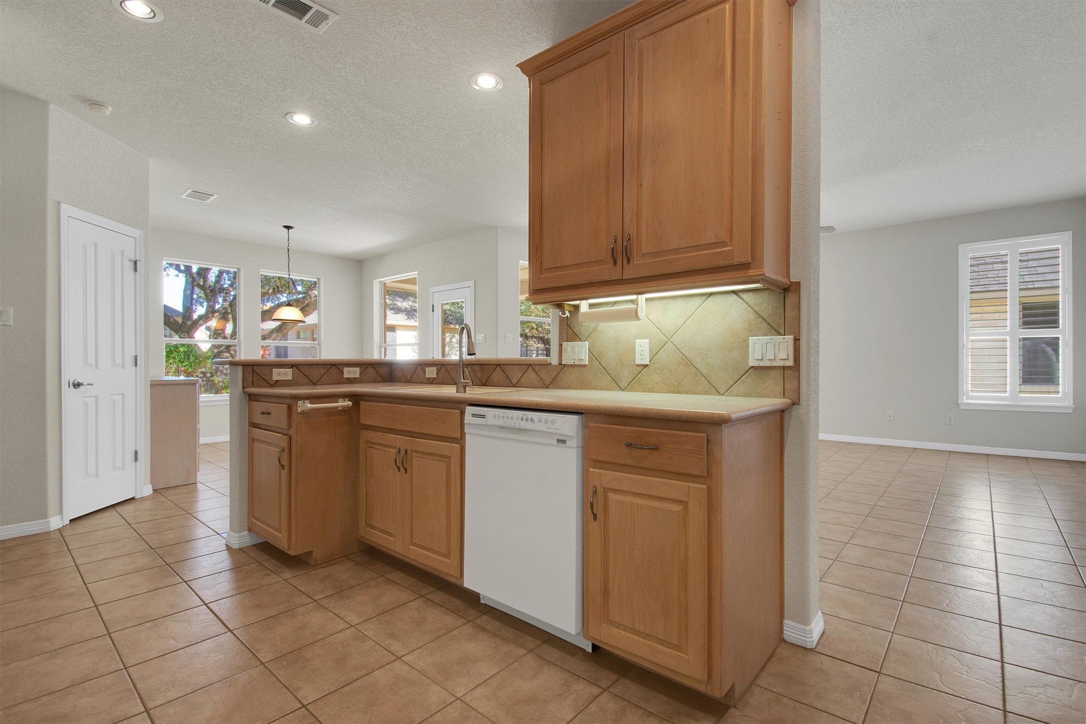 102 Lavaca Lane Georgetown, TX 78628 - Photo 14 of 30 a kitchen with stainless steel appliances granite countertop a sink and cabinets