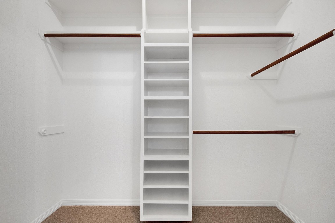 102 Lavaca Lane Georgetown, TX 78628 - Photo 16 of 23 Primary bedroom's walk-in closet, accessed from the bathroom