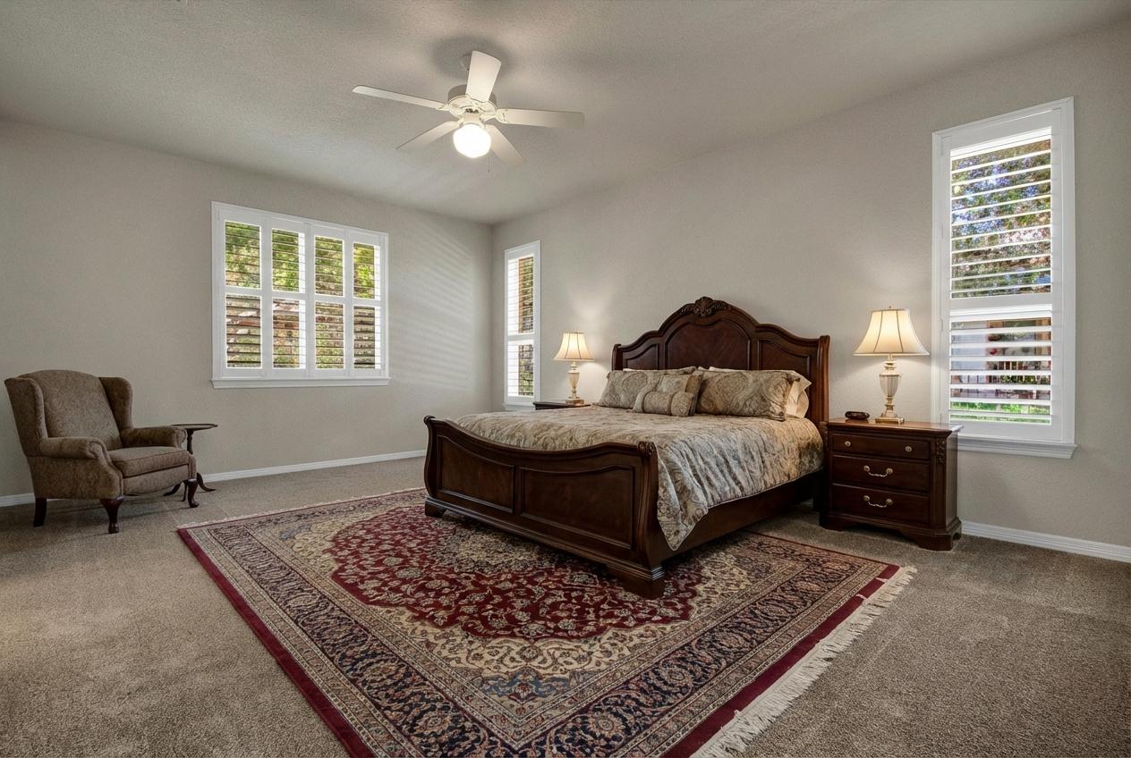 102 Lavaca Lane Georgetown, TX 78628 - Photo 16 of 30 a bedroom with a bed a couch and a window