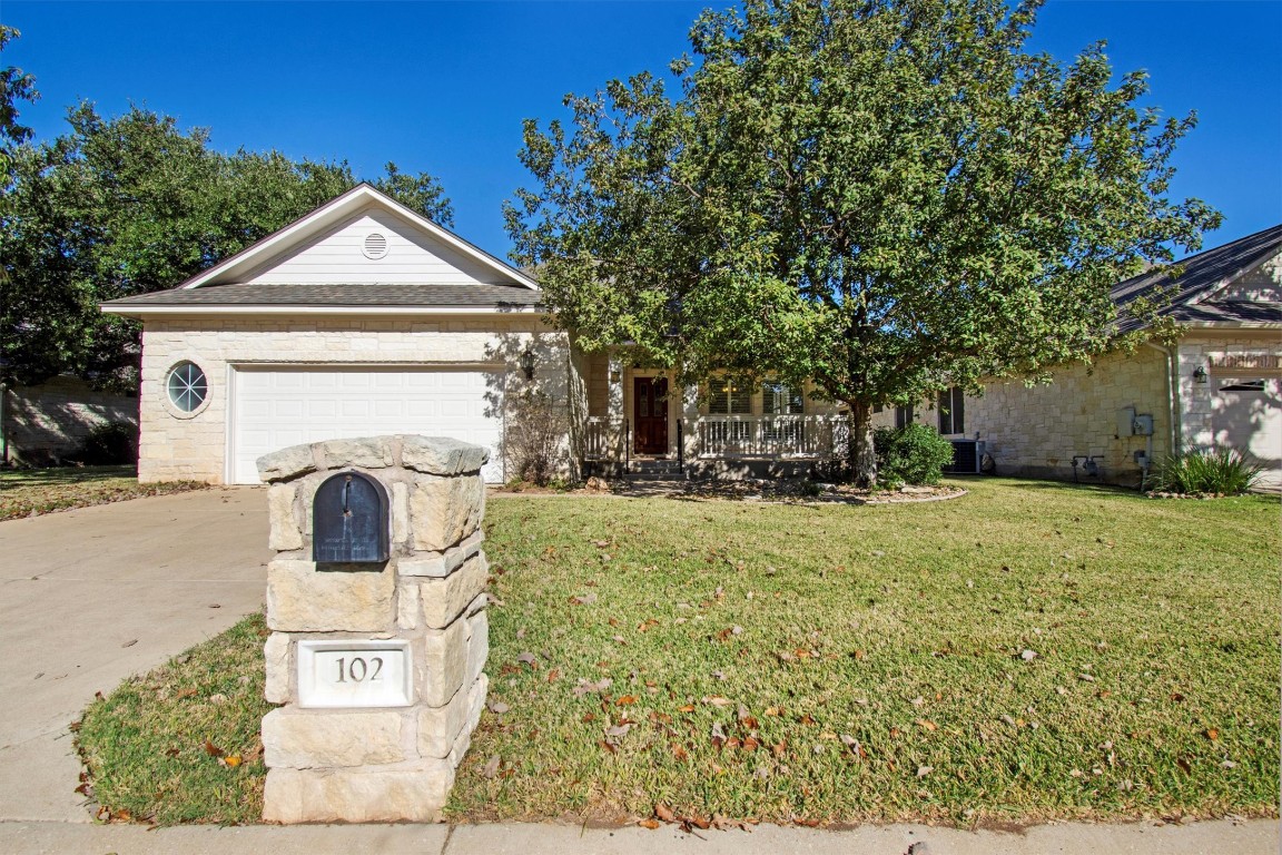 102 Lavaca Lane Georgetown, TX 78628 - Photo 2 of 23 a front view of a house with garden