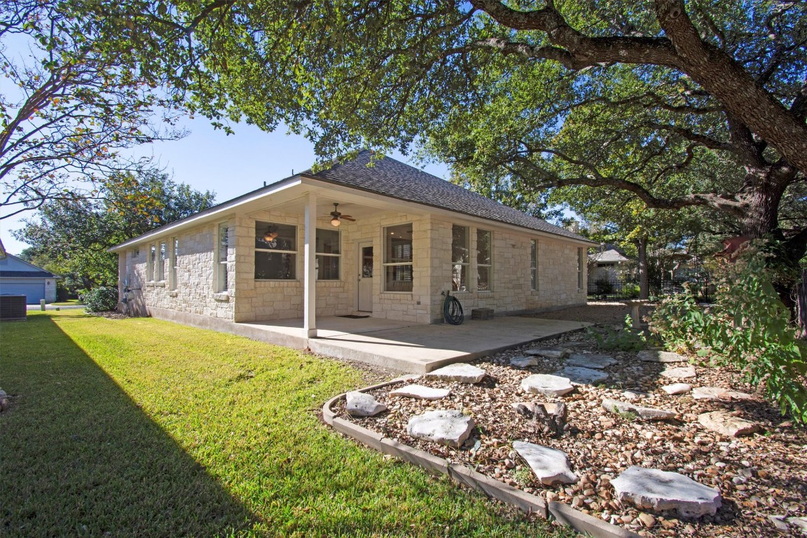 102 Lavaca Lane Georgetown, TX 78628 - Photo 21 of 23 a front view of a house with a garden