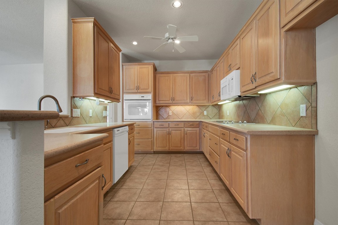 102 Lavaca Lane Georgetown, TX 78628 - Photo 9 of 23 View of the kitchen from the dining room