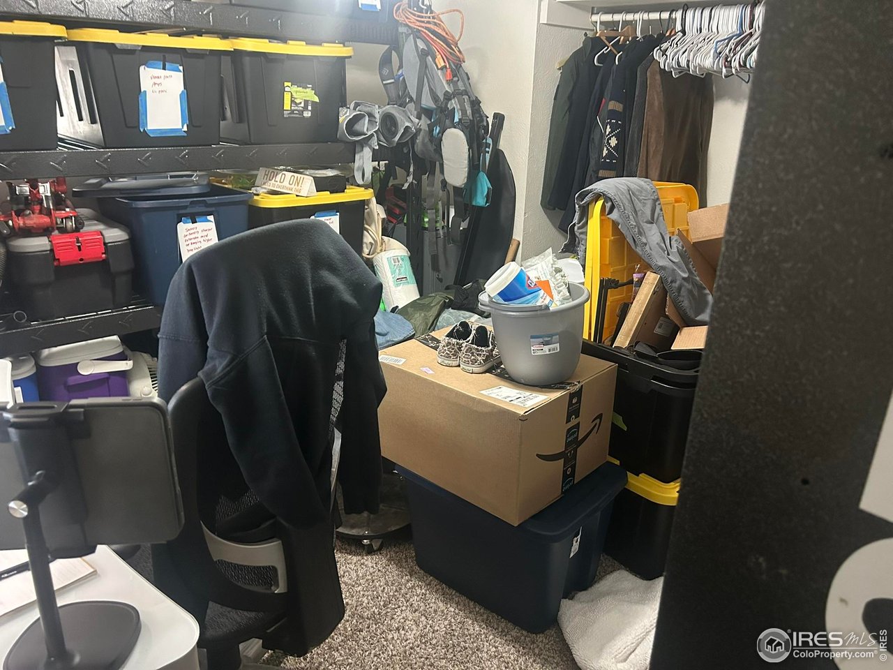1306 Main Street Platteville, CO 80651 - Photo 12 of 15 a view of walk in closet with clothes and shoes