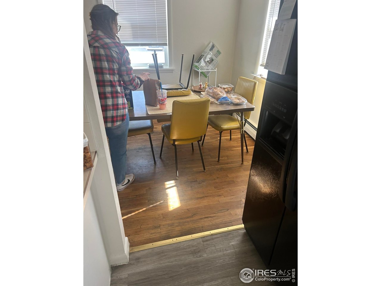 1306 Main Street Platteville, CO 80651 - Photo 7 of 15 a view of a dining room with furniture and window