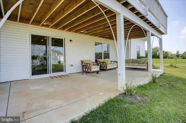 an aerial view of a house with yard swimming pool and outdoor seating