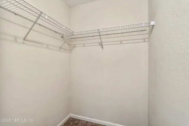 a view of a room with racks on the wall