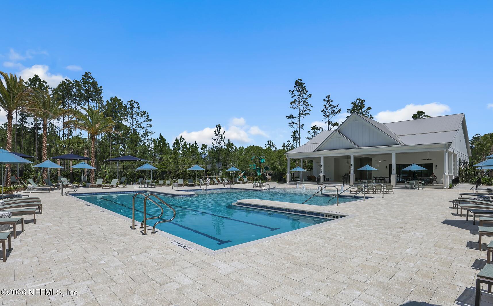 92 Bridgeton Street St. Johns, FL 32259 - Photo 16 of 28 a view of a house with swimming pool and sitting area