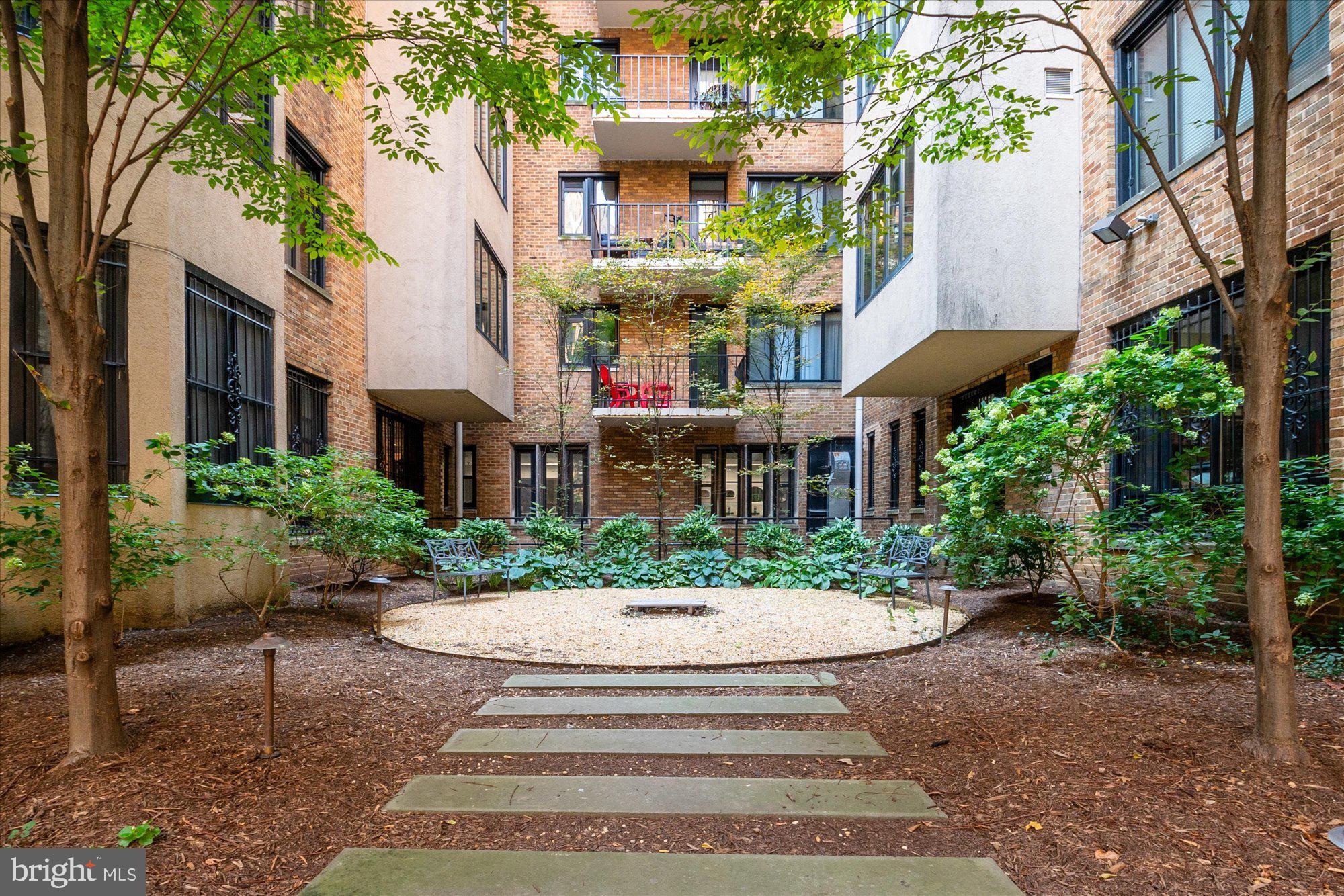 1701 16th Street Northwest, Unit 802 Washington, DC 20009 - Photo 20 of 33 a view of a building with a garden and pathway