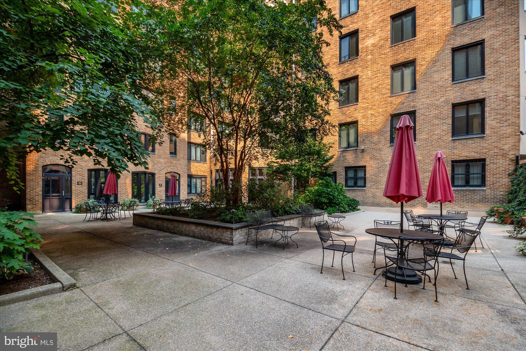 1701 16th Street Northwest, Unit 802 Washington, DC 20009 - Photo 21 of 33 a view of patio with dining table and chairs and plants