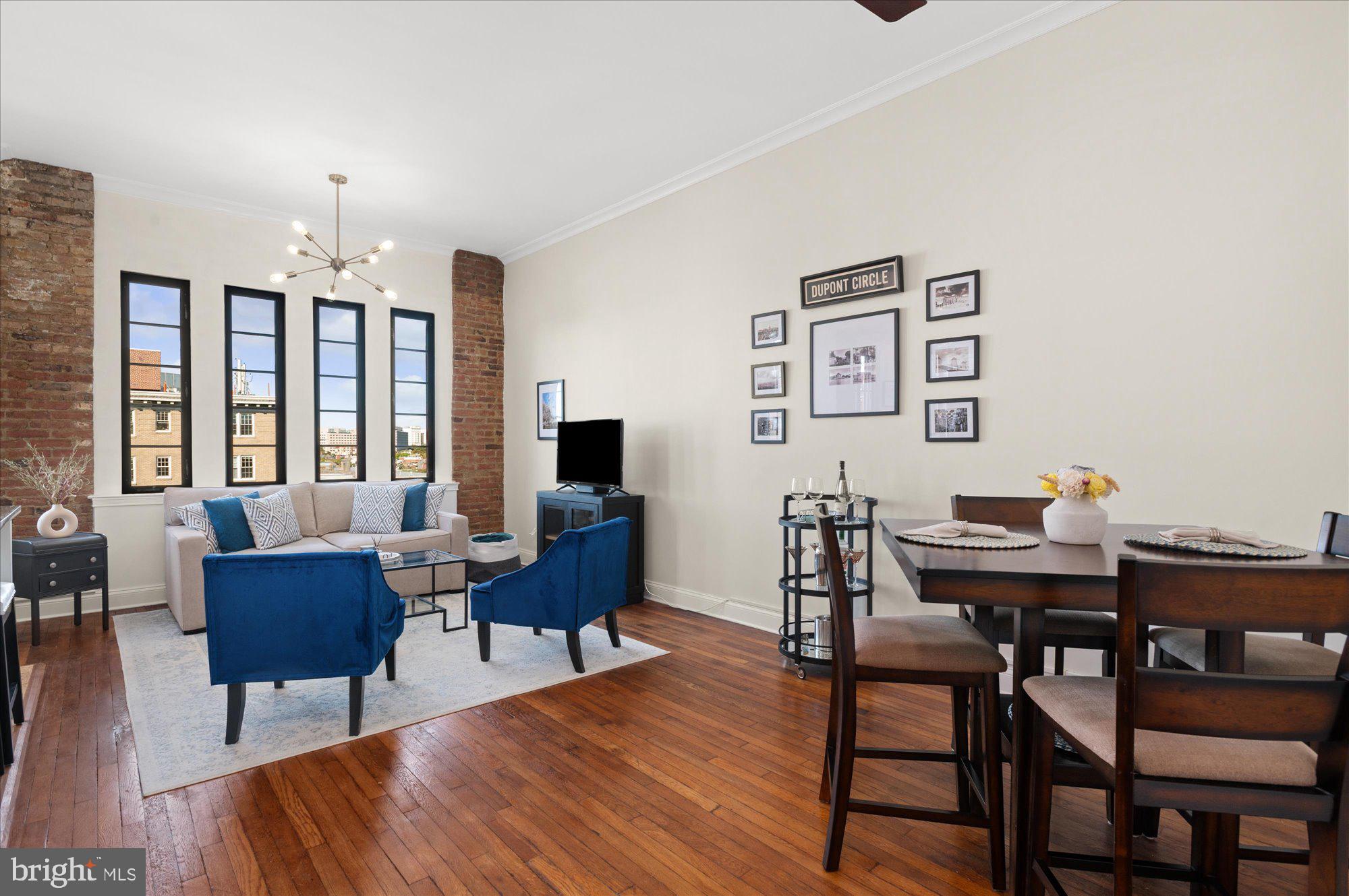 1701 16th Street Northwest, Unit 802 Washington, DC 20009 - Photo 3 of 33 a view of a dining room with furniture window and wooden floor