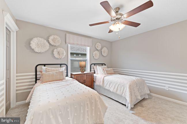 8 Regent Circle Hagerstown, MD 21742 - Photo 14 of 89 a bedroom with two large bed and a chandelier