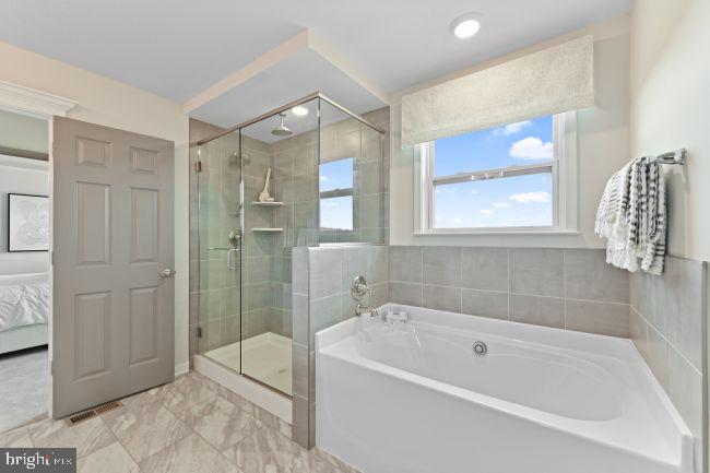 8 Regent Circle Hagerstown, MD 21742 - Photo 18 of 89 a bathroom with a bathtub and a shower