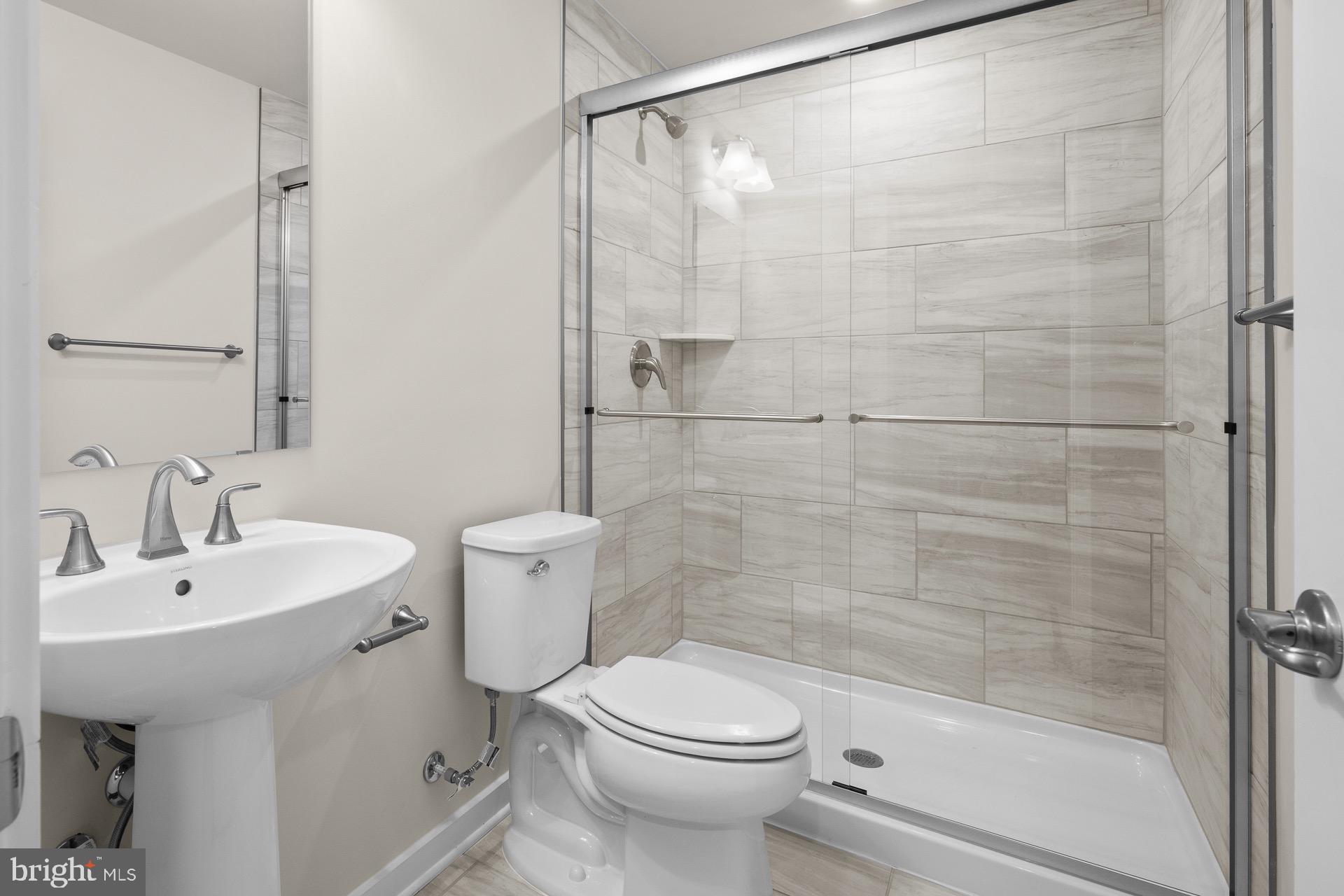 8 Regent Circle Hagerstown, MD 21742 - Photo 37 of 89 a bathroom with a sink mirror toilet and shower