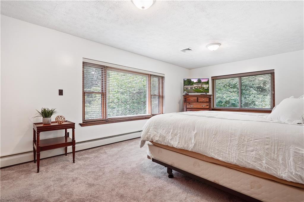 525 Georgetown Road Georgetown, PA 15043 - Photo 13 of 25 Generous master bedroom with large picture windows overlooking the backyard.