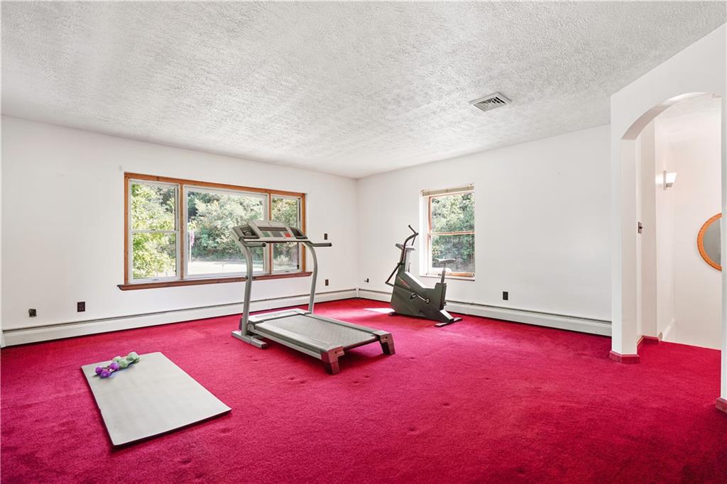 525 Georgetown Road Georgetown, PA 15043 - Photo 20 of 25 Large upper level Family Room currently being used as a workout space. So many possibilities.