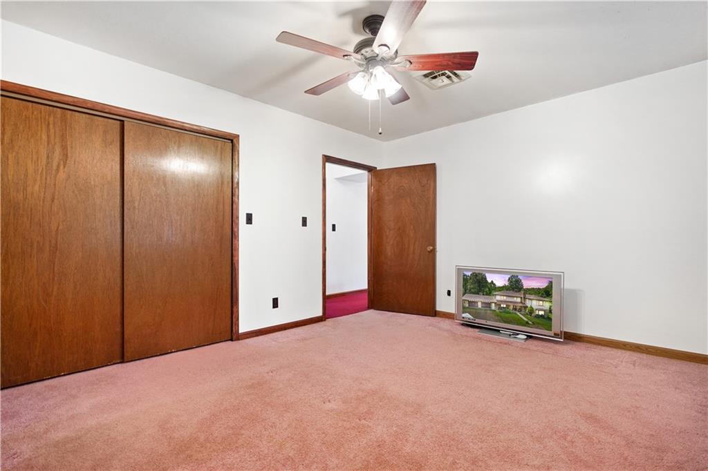 525 Georgetown Road Georgetown, PA 15043 - Photo 21 of 25 Main floor guest bedroom complete with large closet and ceiling fan.