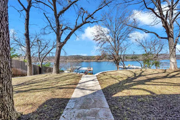 a view of a yard with a tree