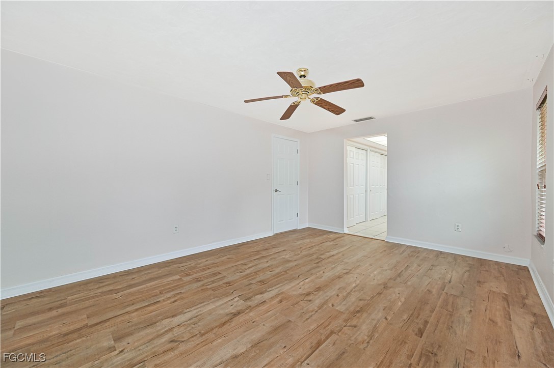 4255 Glasgow Court North Fort Myers, FL 33903 - Photo 15 of 35 a view of empty room with wooden floor