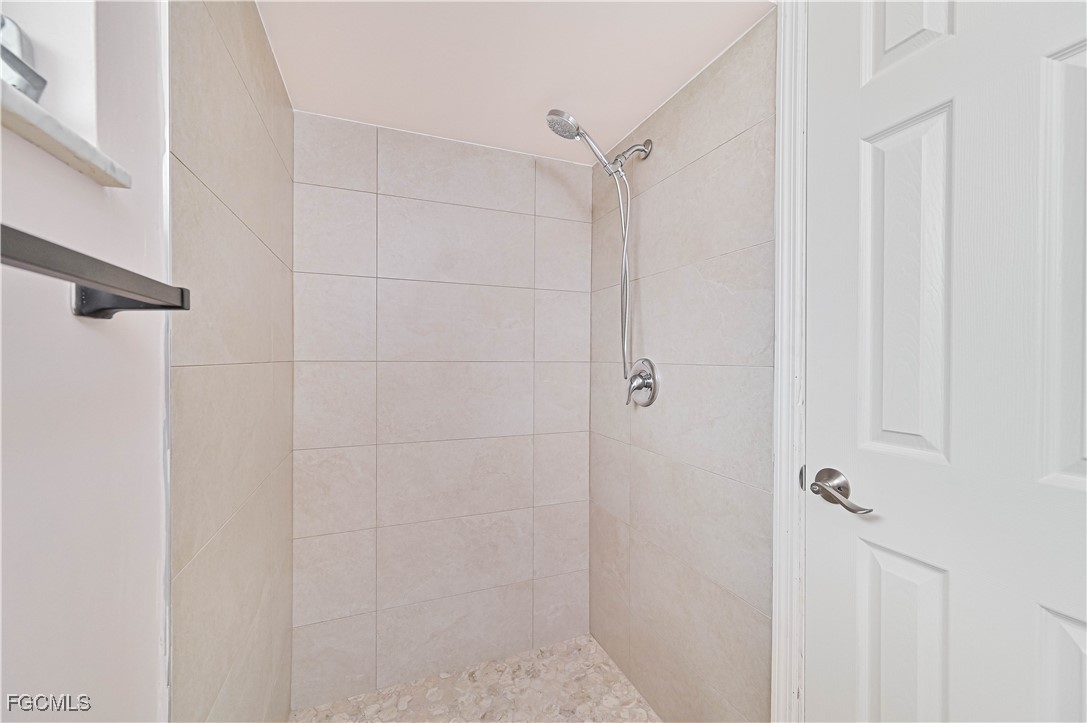 4255 Glasgow Court North Fort Myers, FL 33903 - Photo 19 of 35 a bathroom with a shower