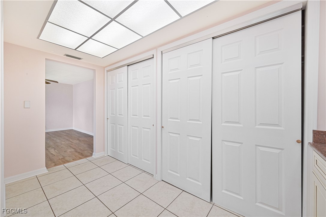 4255 Glasgow Court North Fort Myers, FL 33903 - Photo 20 of 35 a view of a closet area with ceiling fan