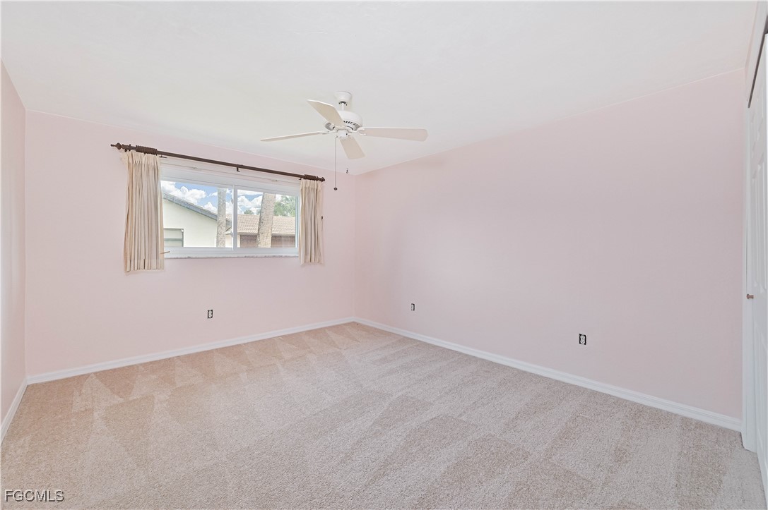 4255 Glasgow Court North Fort Myers, FL 33903 - Photo 21 of 35 an empty room with a window