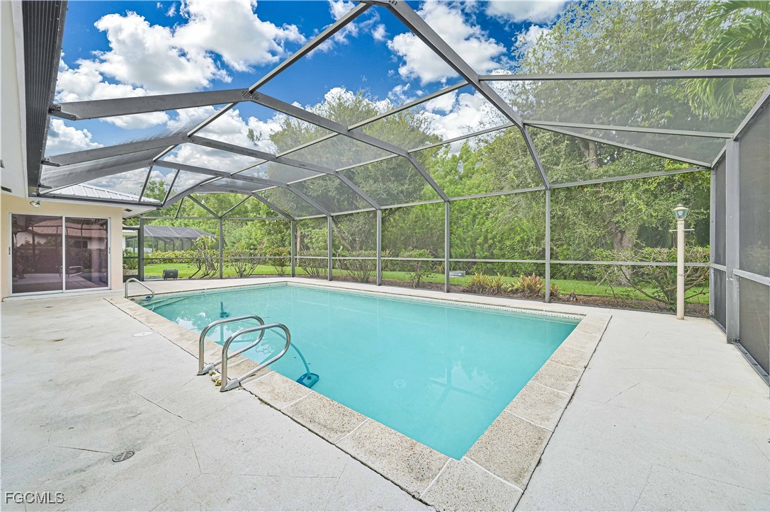 4255 Glasgow Court North Fort Myers, FL 33903 - Photo 28 of 35 a view of a backyard with a swimming pool