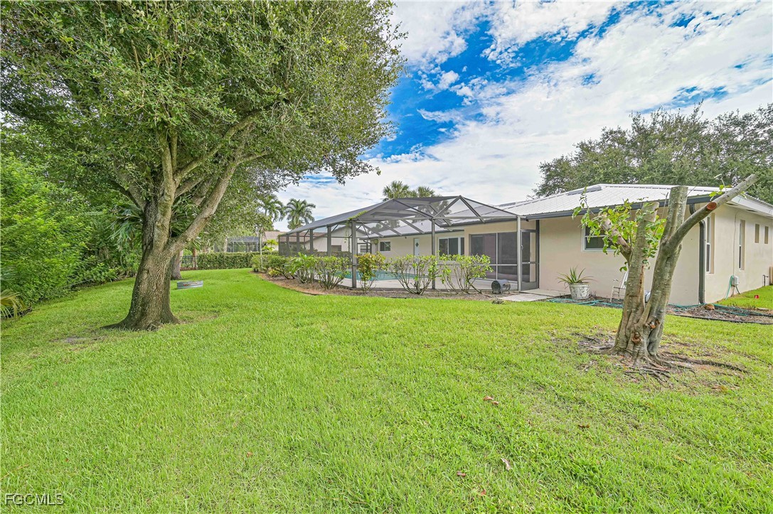 4255 Glasgow Court North Fort Myers, FL 33903 - Photo 29 of 35 a front view of house with yard and green space