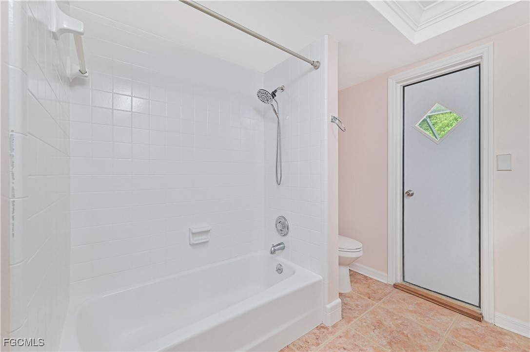 4255 Glasgow Court North Fort Myers, FL 33903 - Photo 30 of 35 a bathroom with a bathtub and a shower