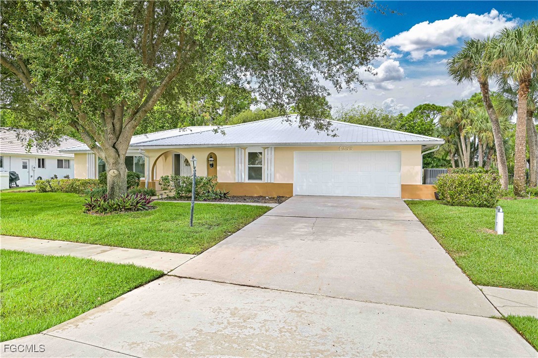 4255 Glasgow Court North Fort Myers, FL 33903 - Photo 34 of 35 a front view of a house with a yard