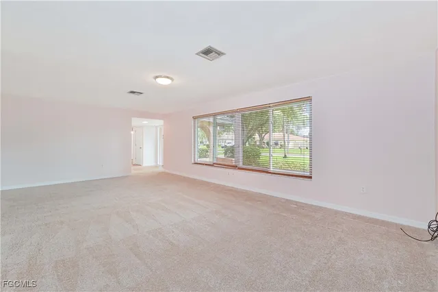 a view of a room that has a window in it